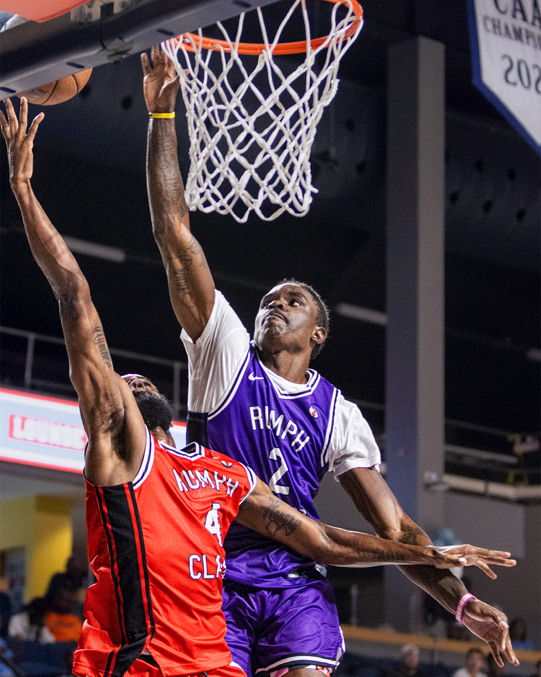 Danny Rumph Classic player in purple finishing near the basket