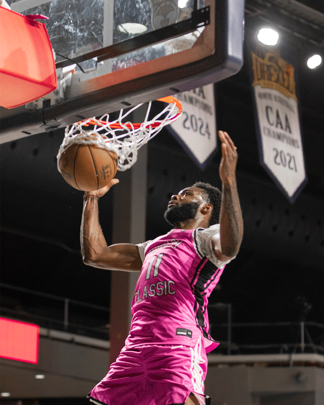 Danny Rumph Classic pink jersey player finishing a layup