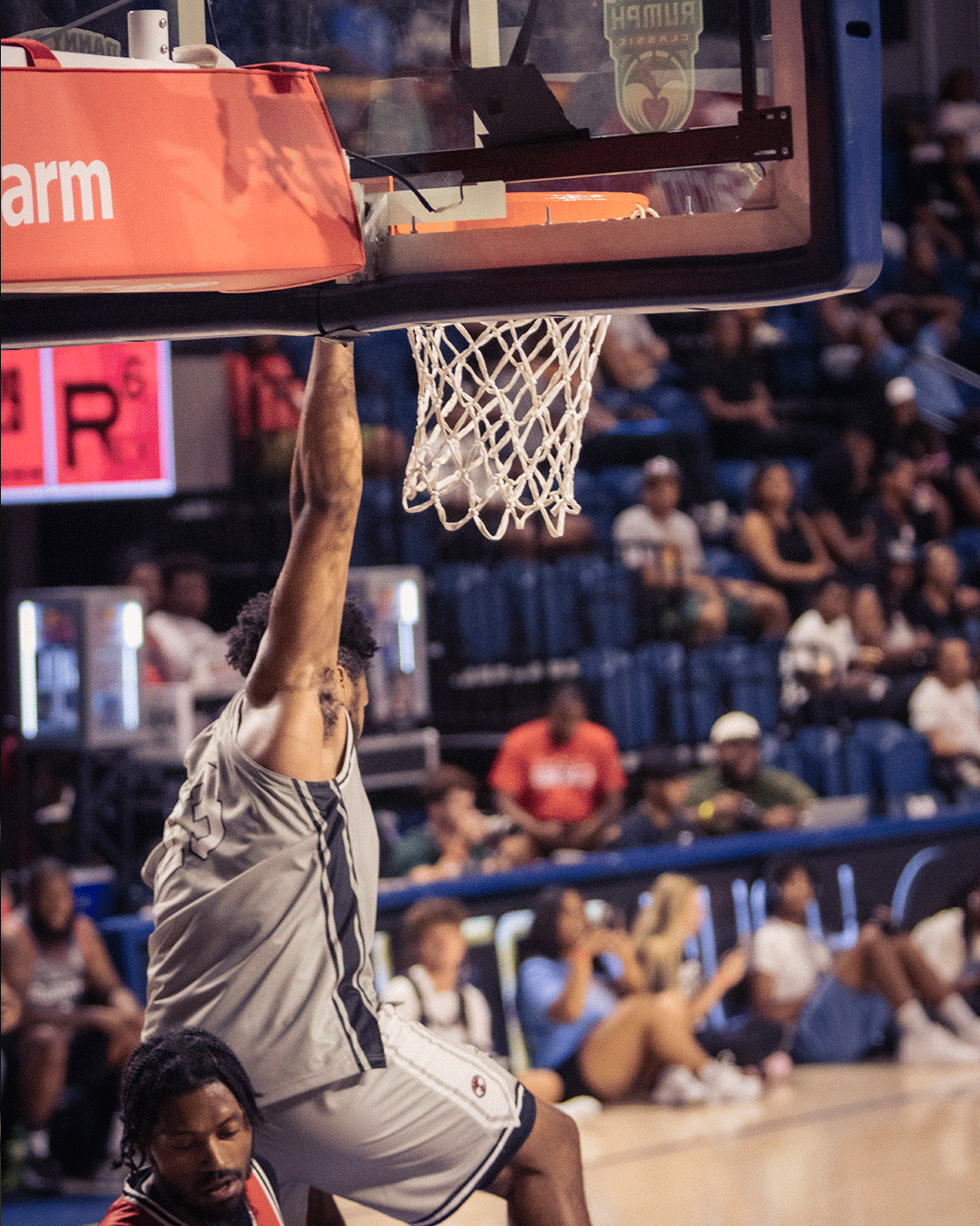 Danny Rumph Classic gray jersey player dunking under the backboard