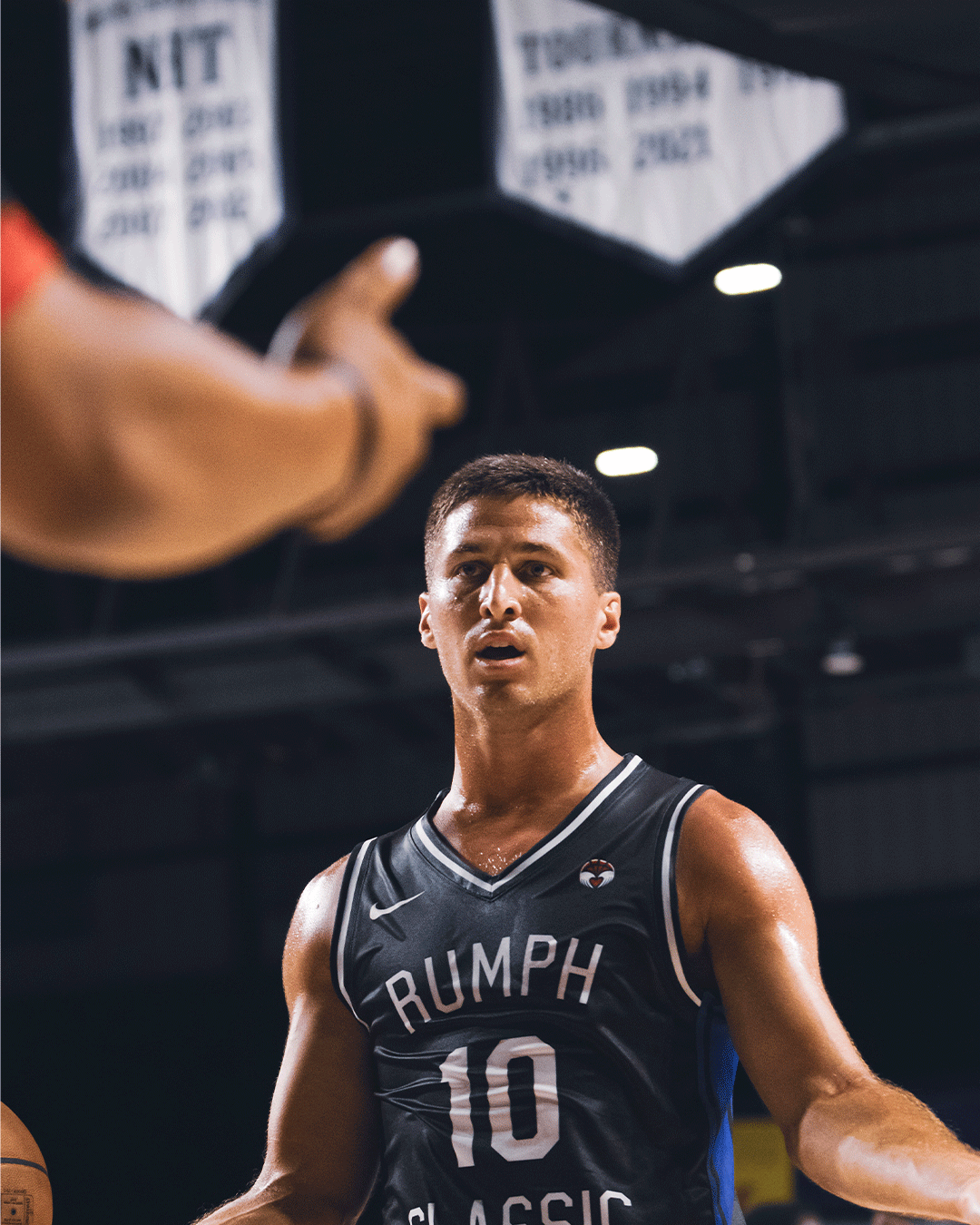 Danny Rumph Classic black jersey player portrait under arena banners