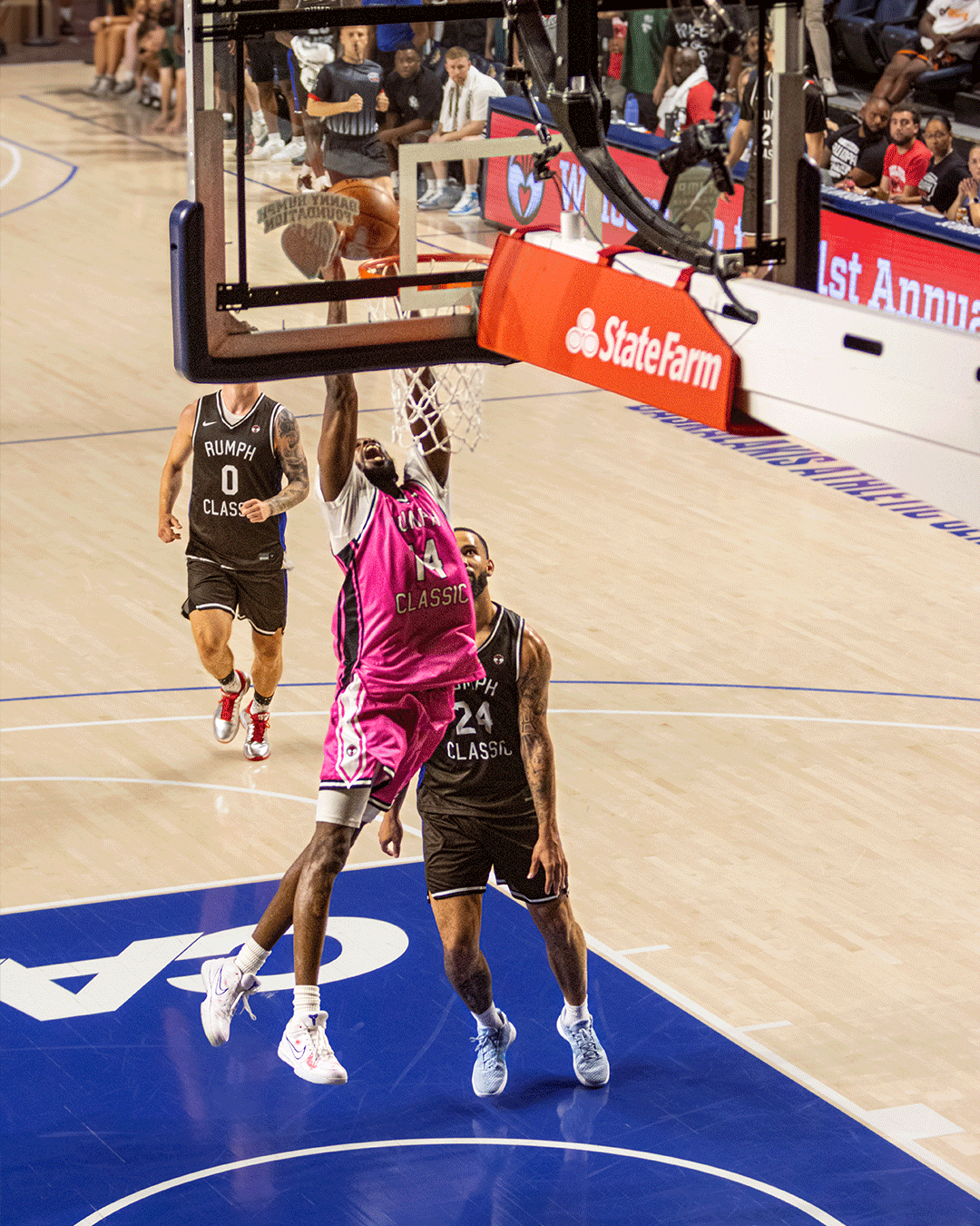 Danny Rumph Classic pink jersey player dunking from above the lane