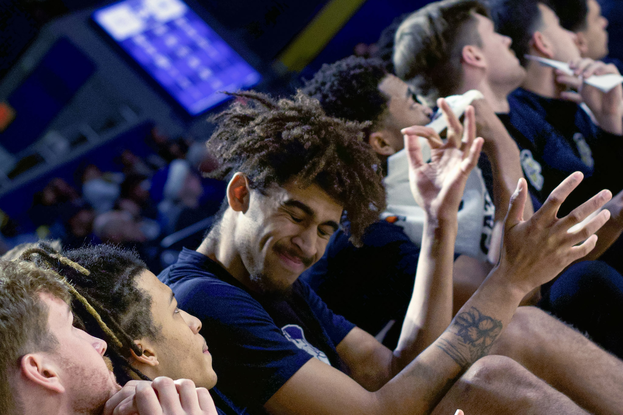 Drexel basketball bench celebration smile