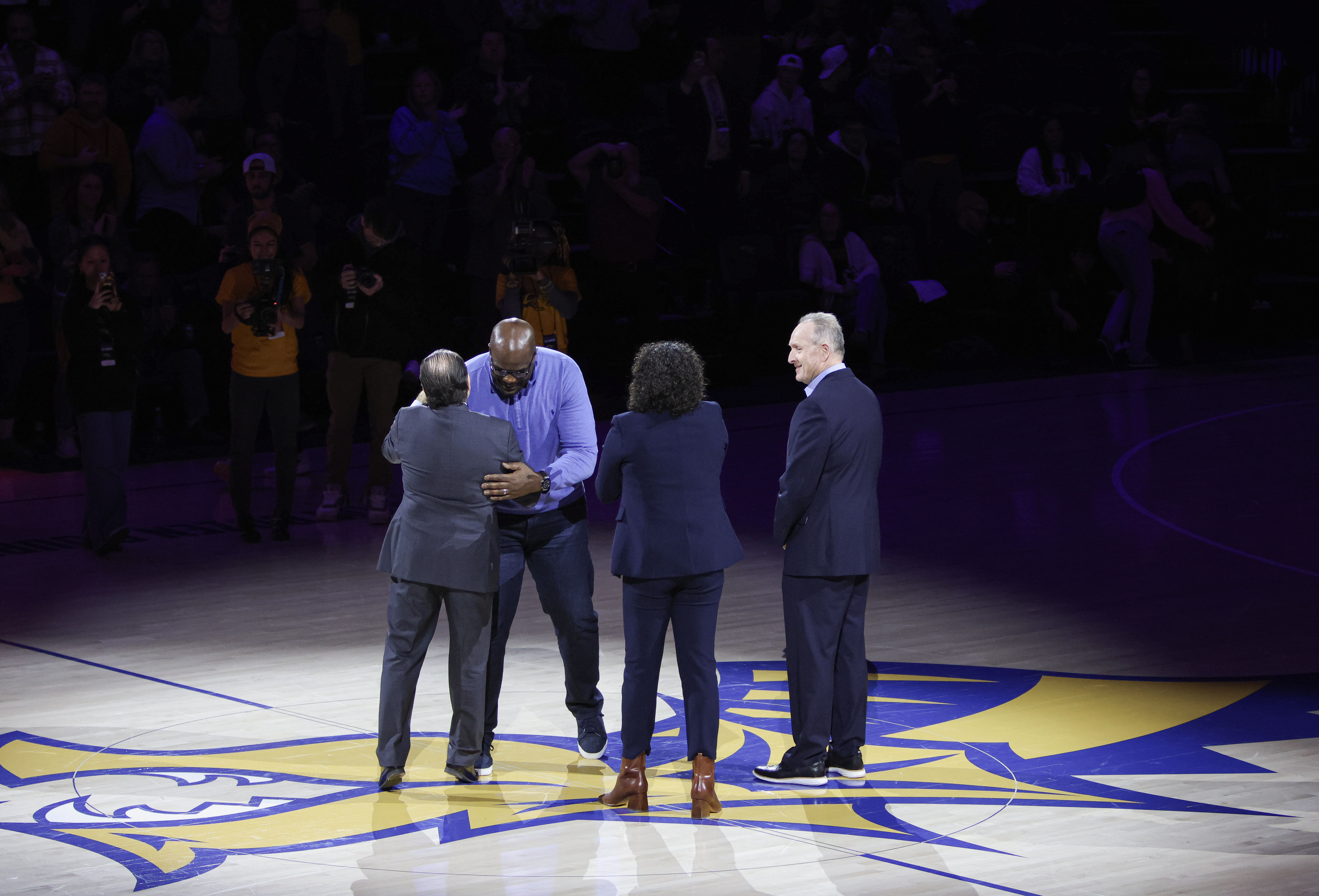 Drexel center court recognition ceremony under arena lights