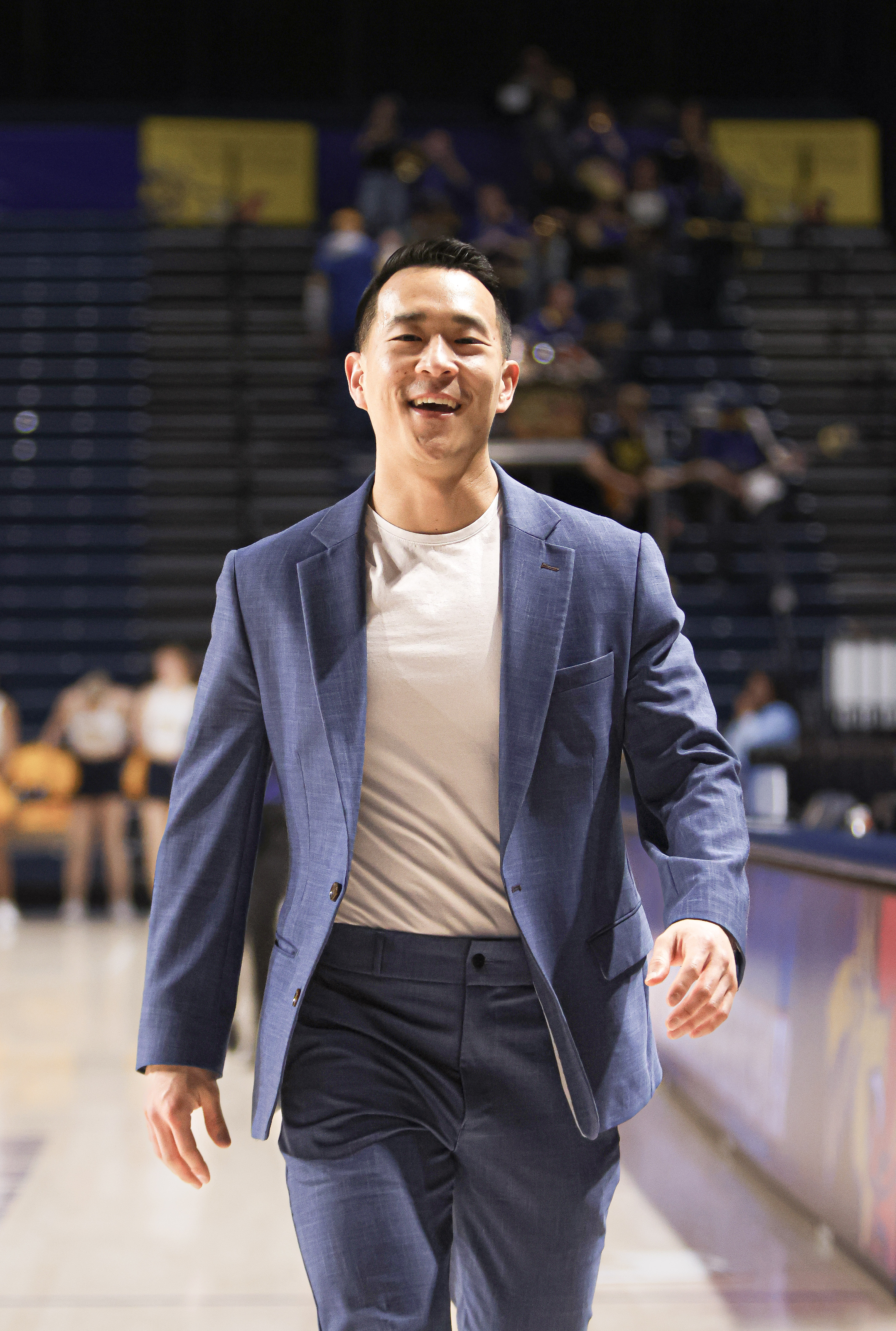 Drexel coach walking along the court