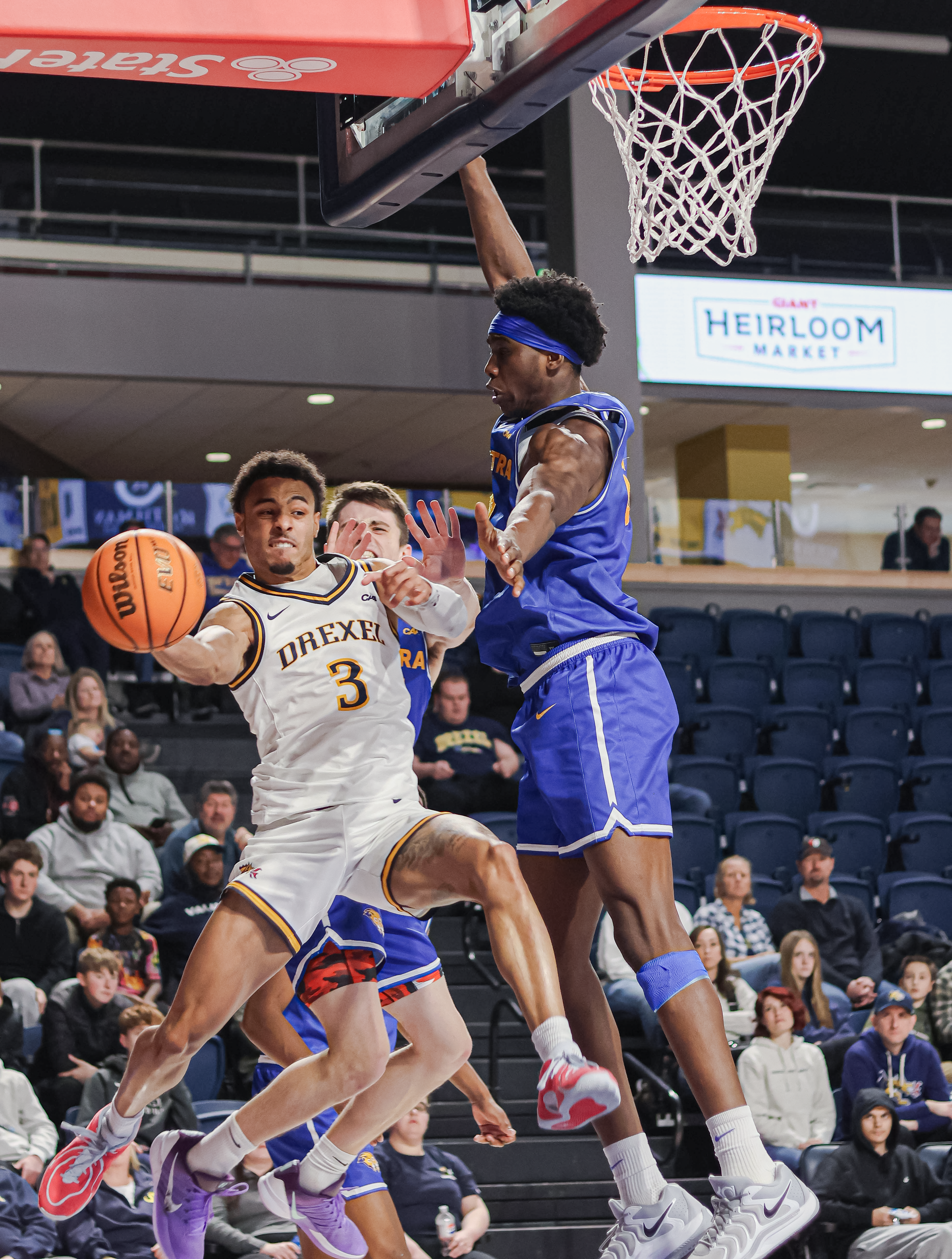 Drexel basketball player driving under the basket