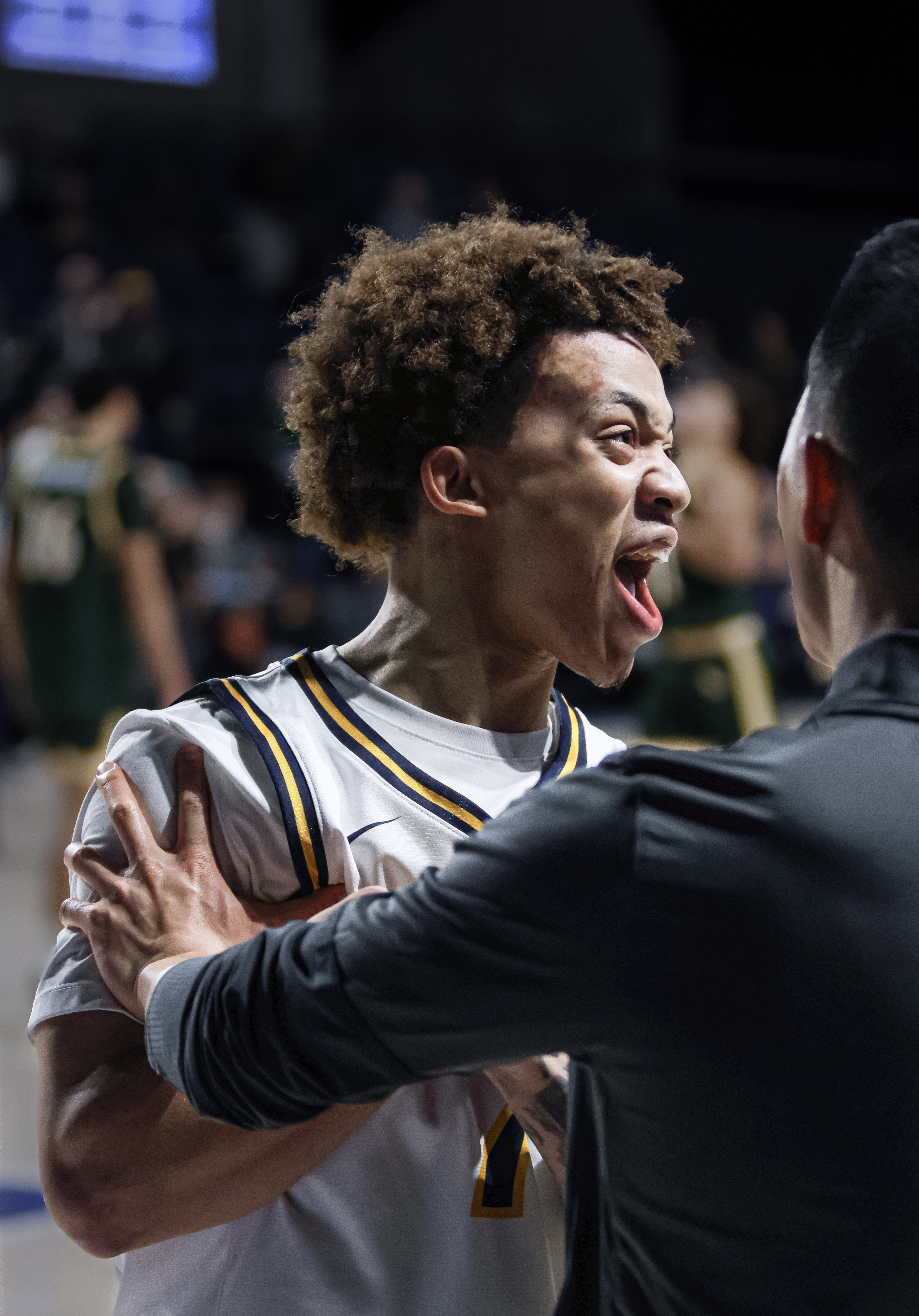 Drexel player celebrating with a coach