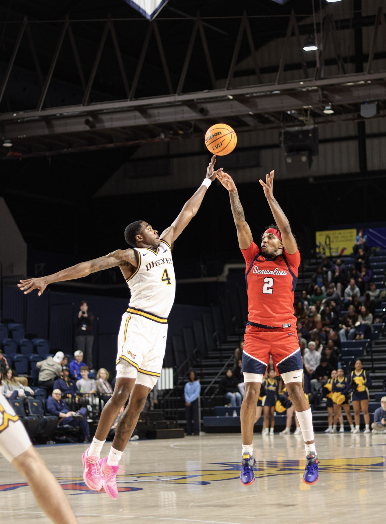 Drexel basketball player contesting a jump shot