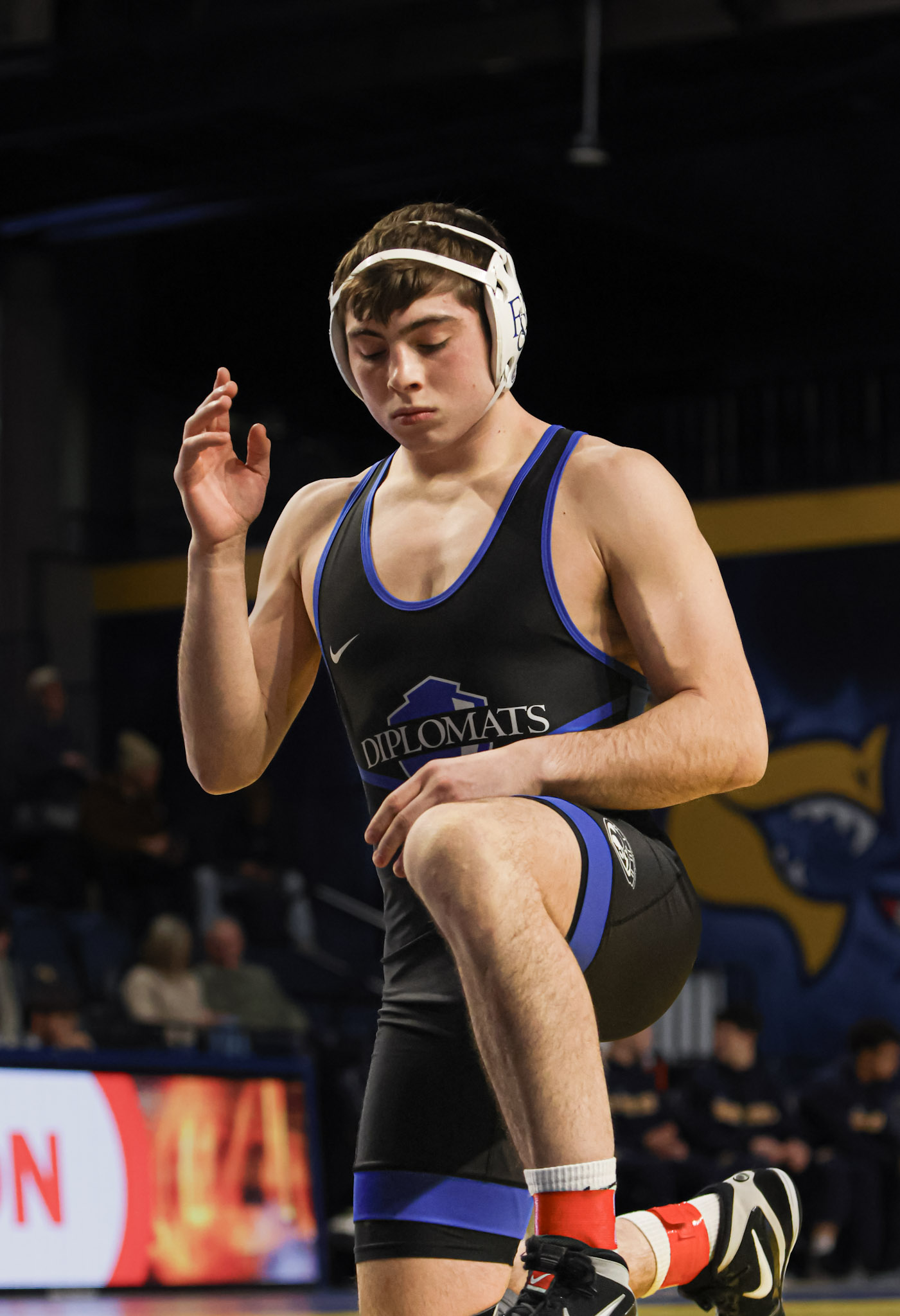 Drexel wrestler raising his knee before a match