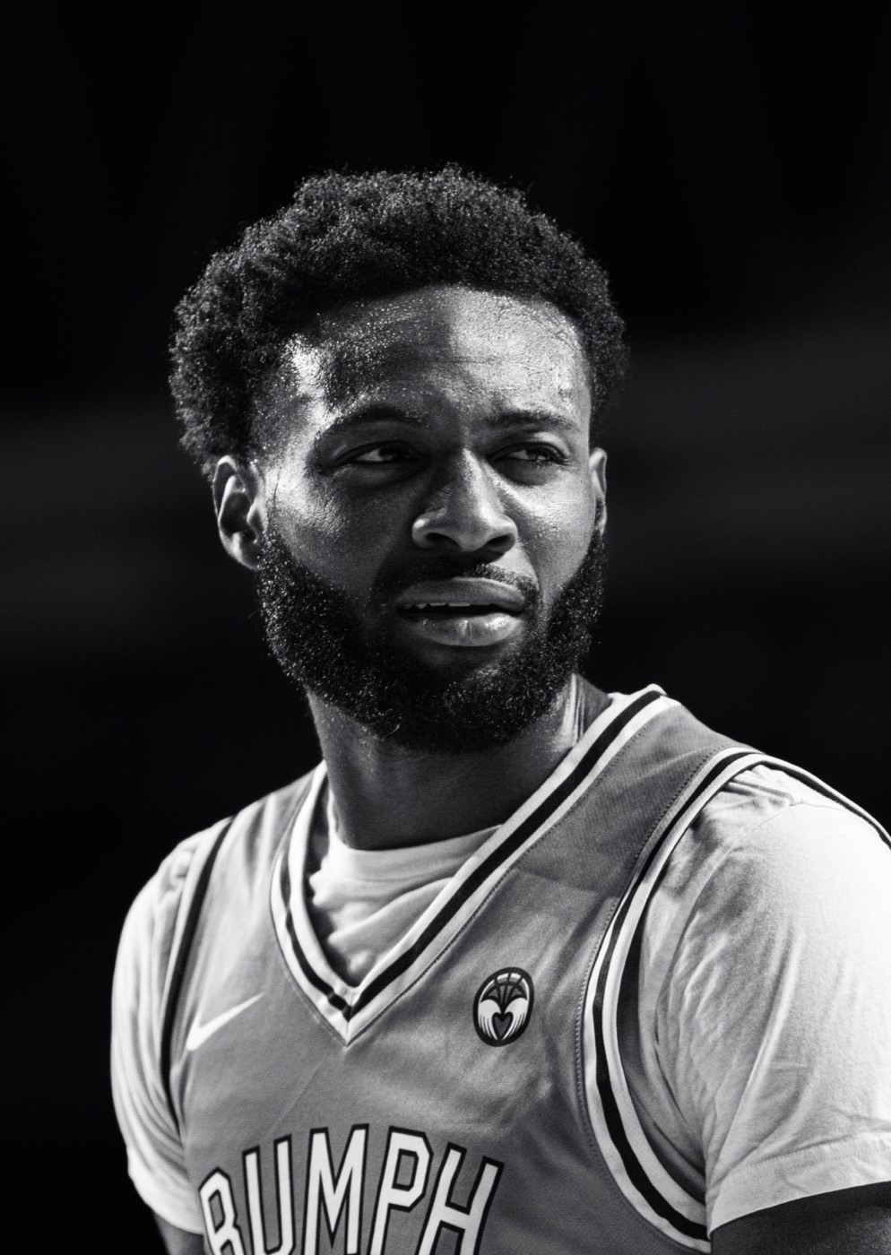 Black and white portrait of Jaylen Brown in a Rumph Classic jersey