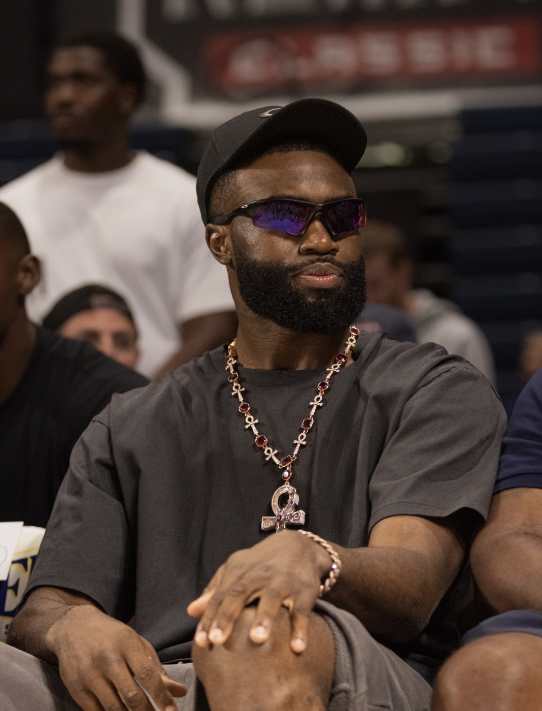 Jaylen Brown courtside portrait wearing sunglasses and a statement necklace