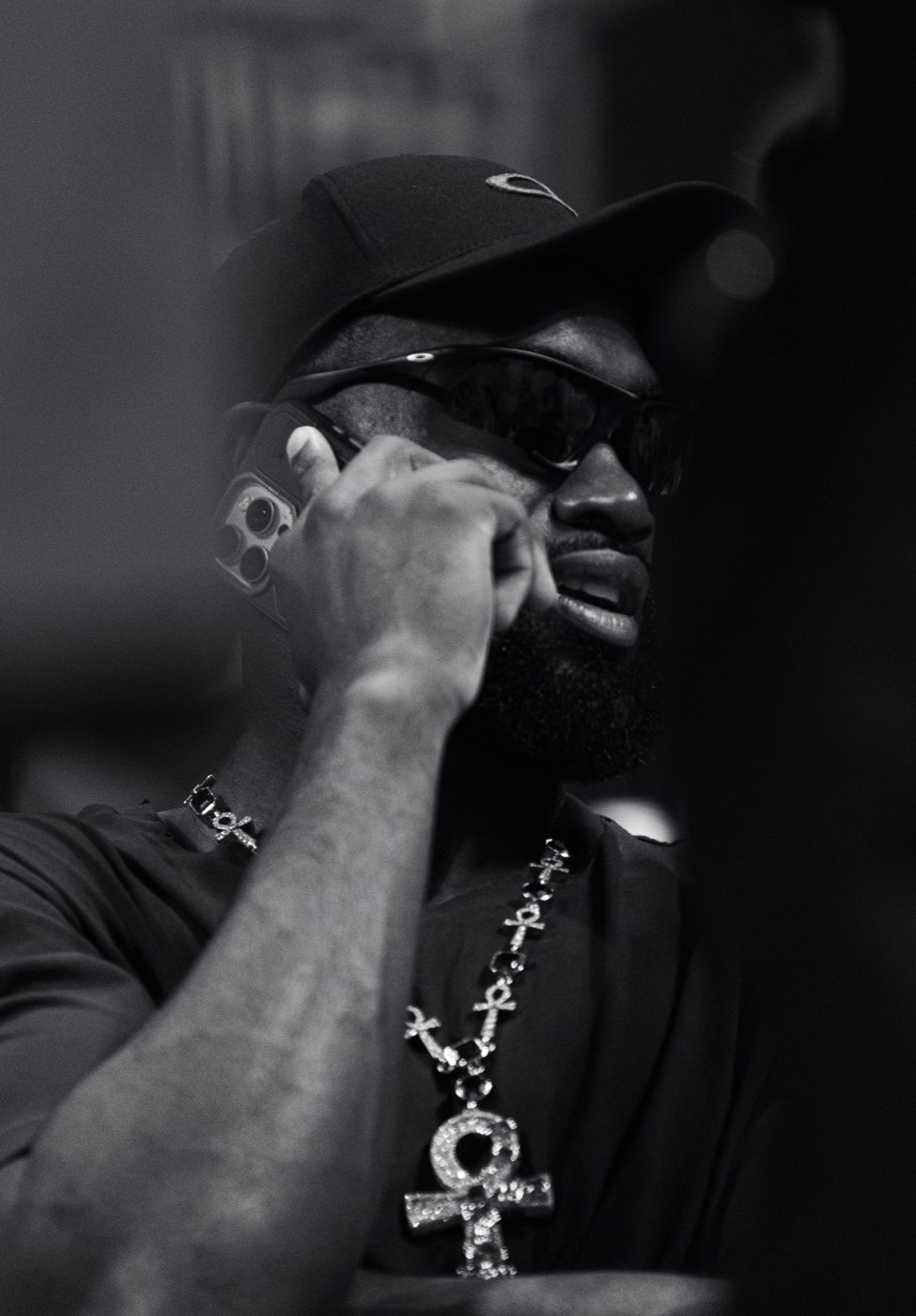 Black and white Jaylen Brown phone portrait with sunglasses and necklace
