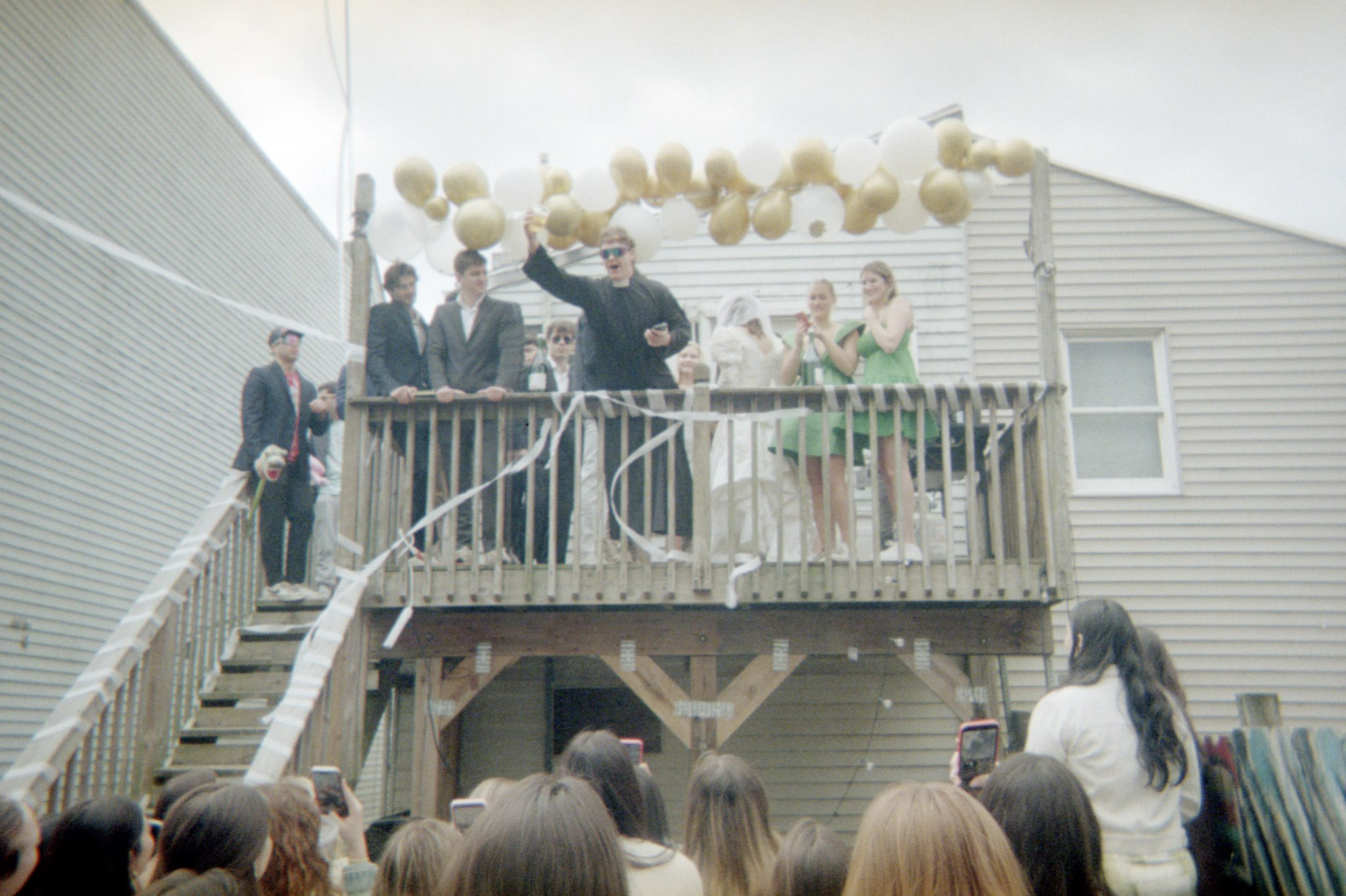 Balcony celebration with streamers and balloons