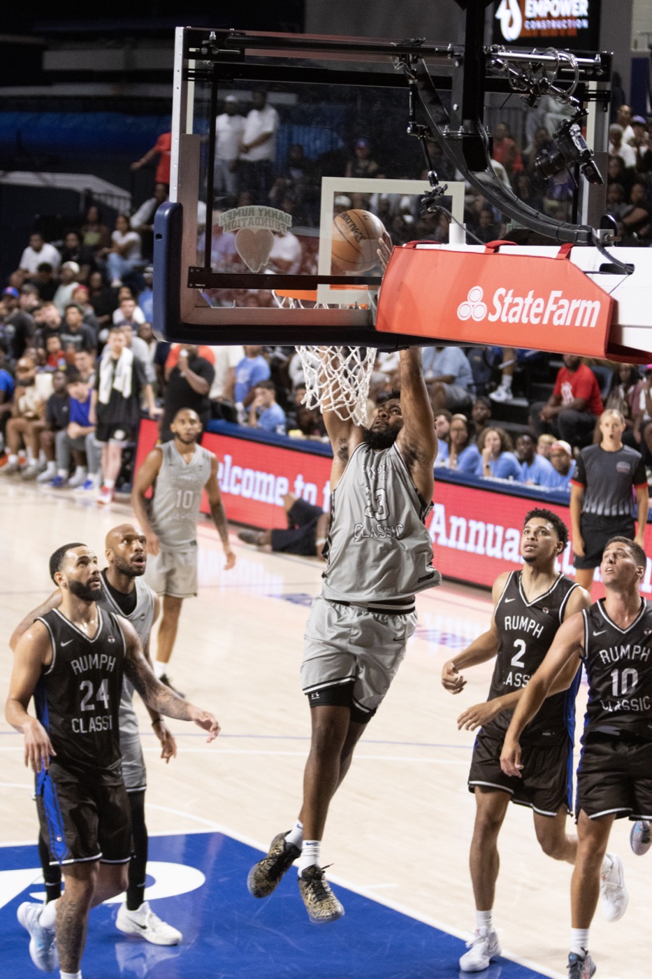 Rumph Classic player finishing a layup under the backboard