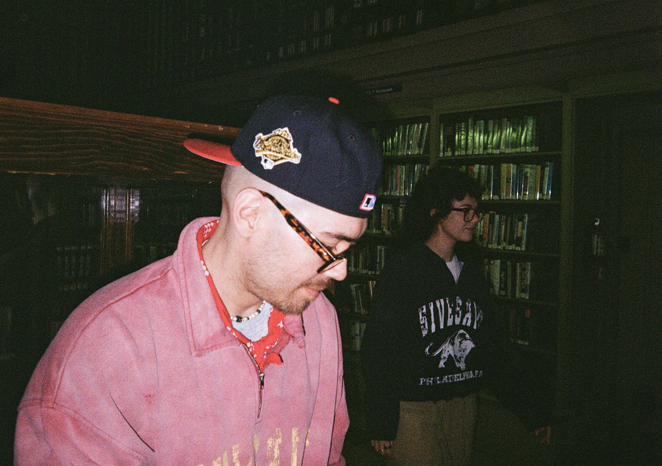 Fith and Saint streetwear portrait in a library