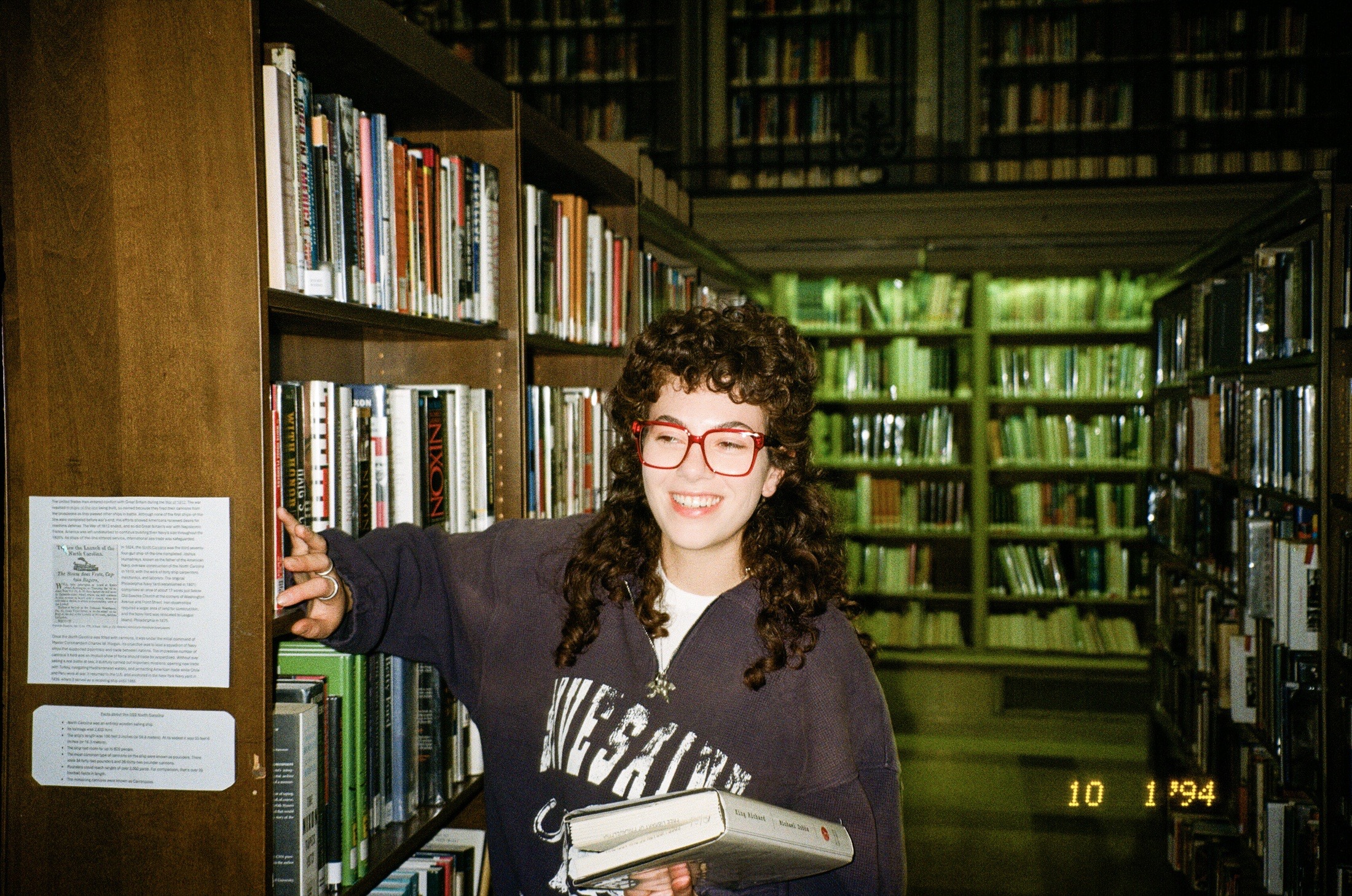Fith and Saint smiling library portrait