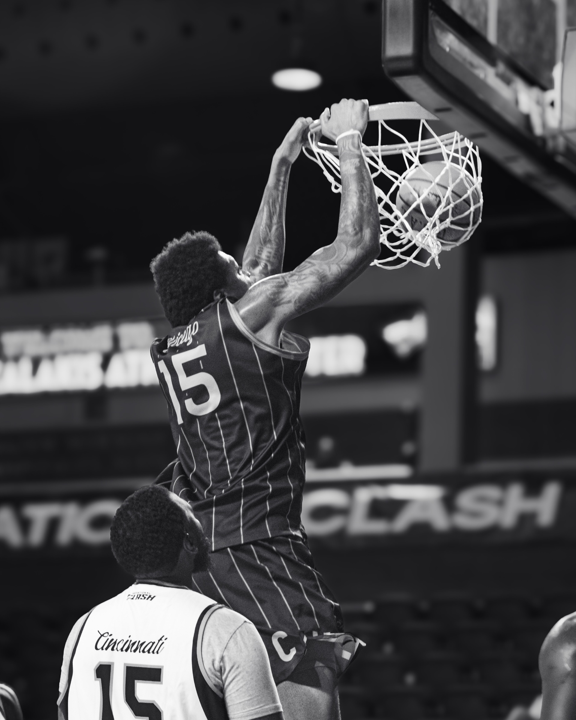Black and white Invitational Clash dunk at the rim