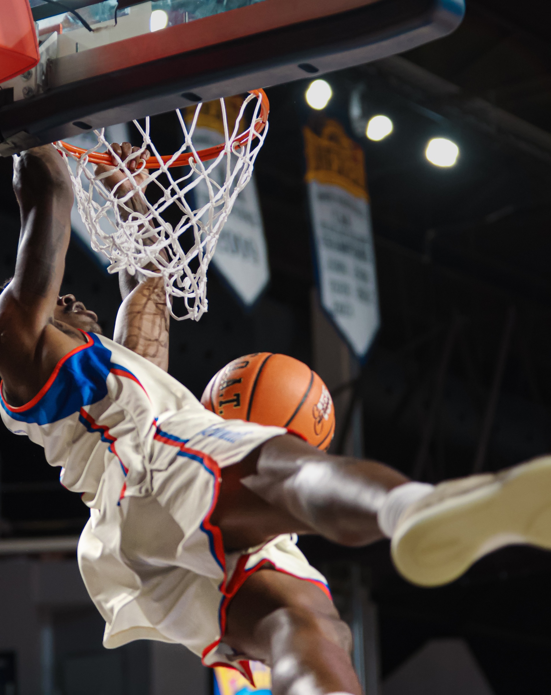 Acrobatic Invitational Clash dunk beneath the basket