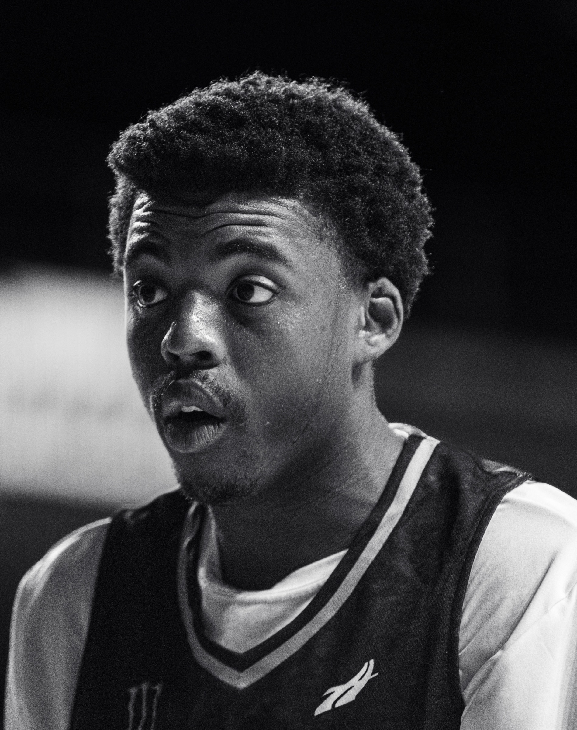 Black and white courtside portrait of an Invitational Clash player