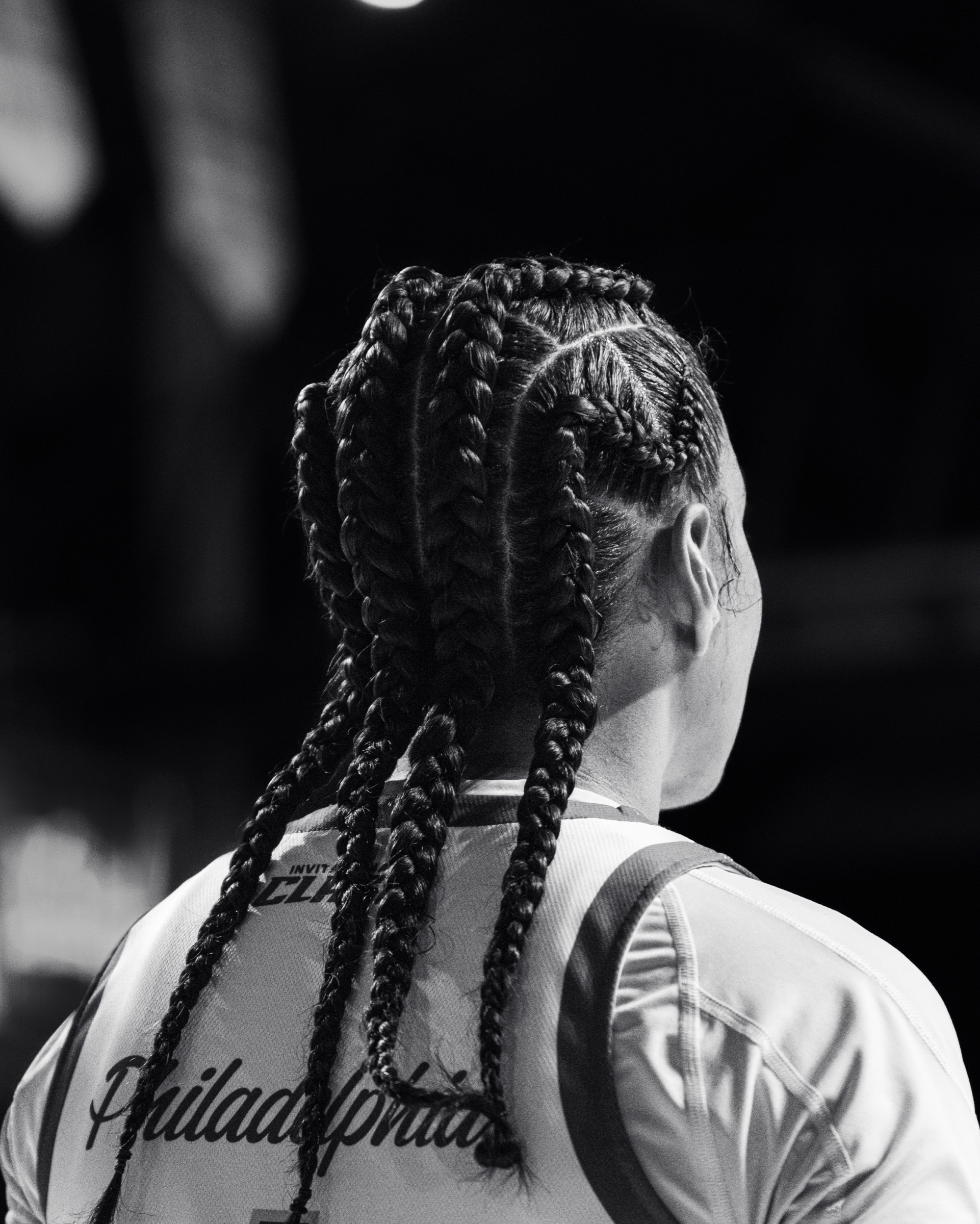 Black and white portrait of a Philadelphia player with braided hair