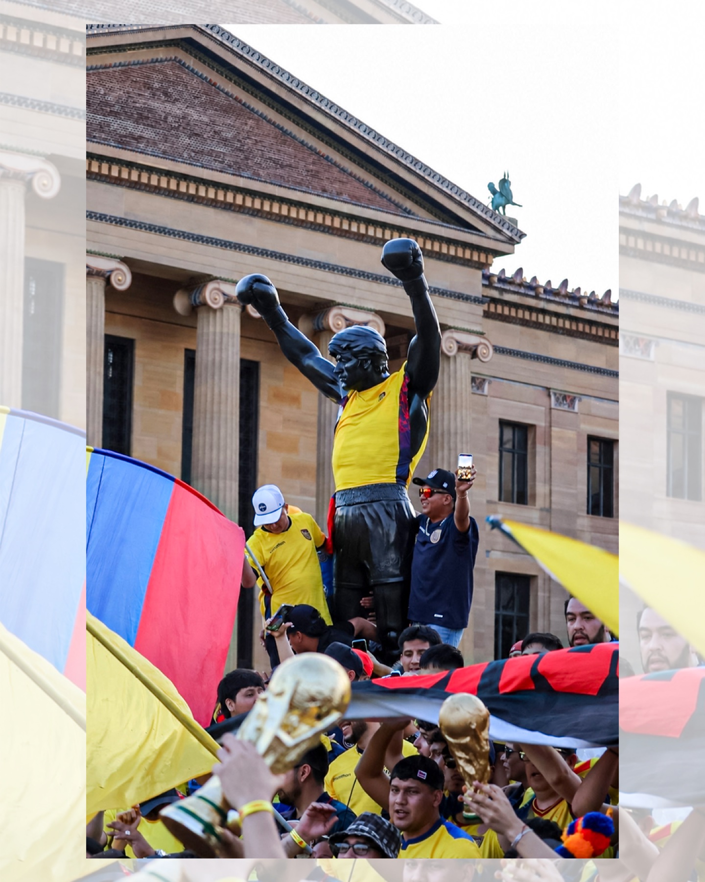 La Tri fans celebrating with flags near the Rocky statue