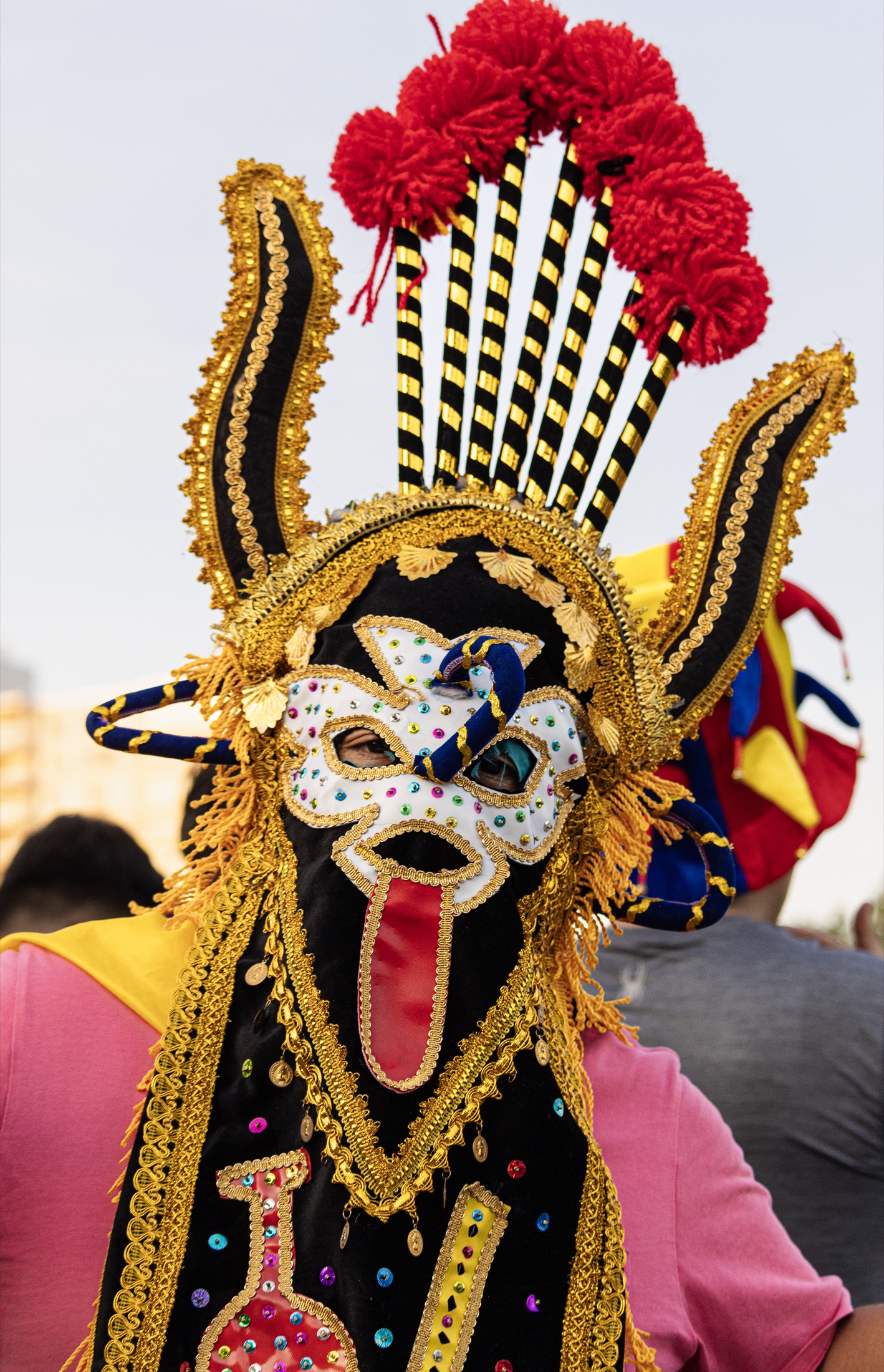 Ecuadorian fan in colorful festival mask