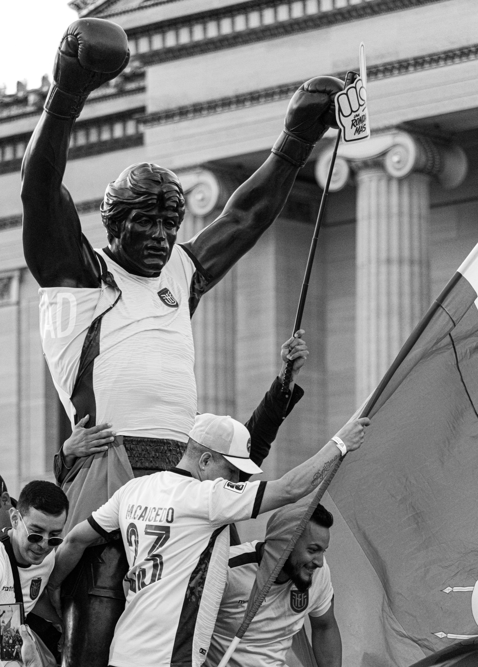 Close black and white Rocky statue scene with Ecuadorian fans