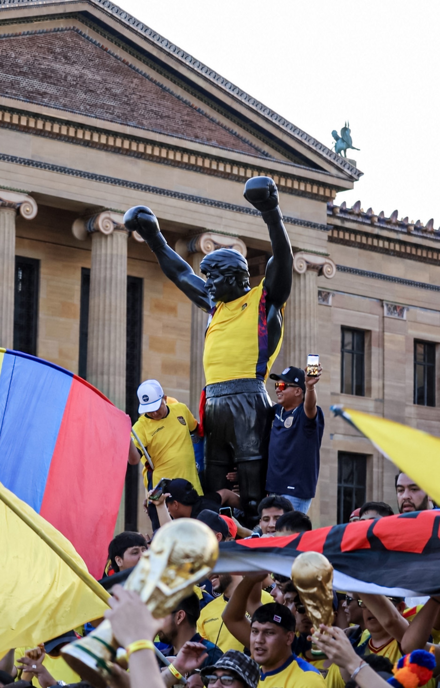 Color Rocky statue scene with Ecuadorian fans and flags