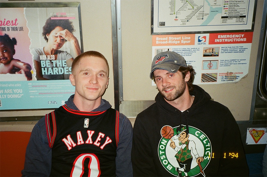 Two SEPTA riders sitting on the Broad Street Line